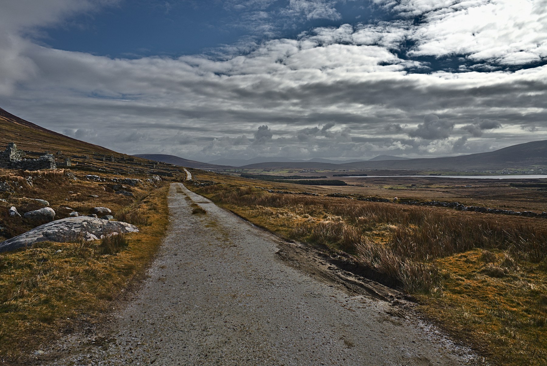 Narrow road through open scenery on Achill Island in western Ireland